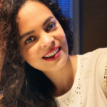 A woman smiling